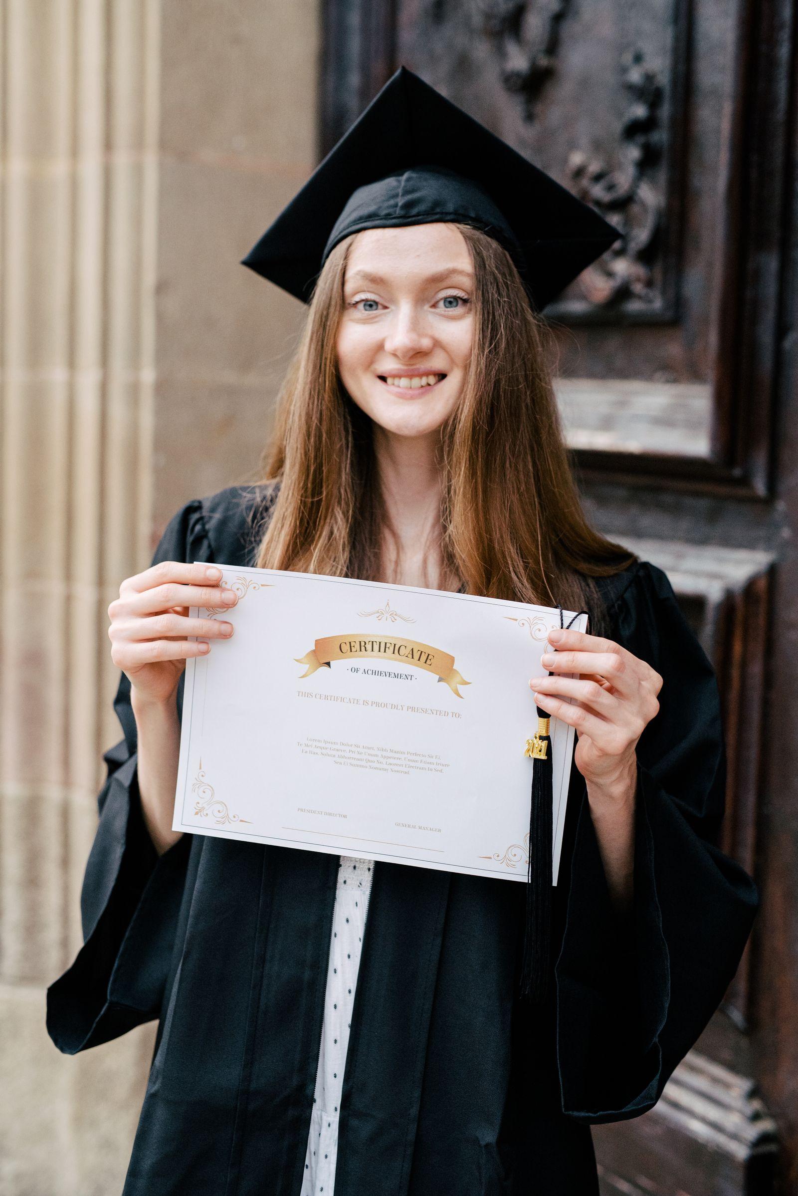Graduate proudly holding her diploma — credentials ready for translation and evaluation
